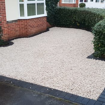 Front garden of house with gravel on