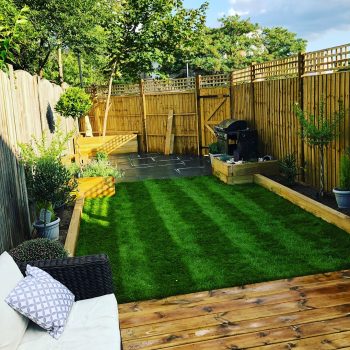 Garden with artificial grass and fencing